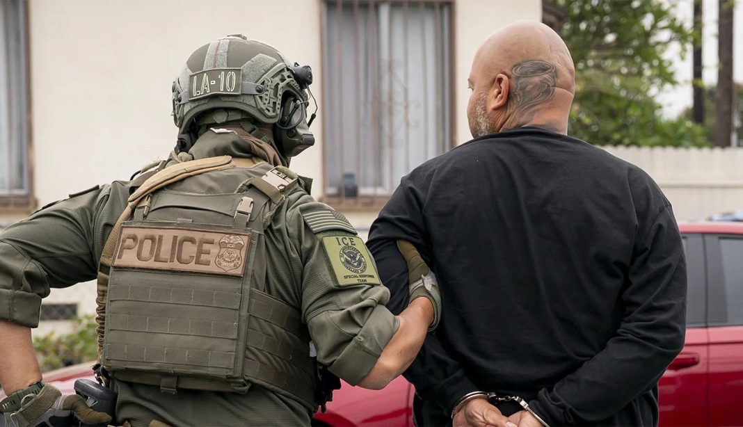 deportations, deportation An officer with U.S. Immigration and Customs Enforcement detains a man during an enforcement operation in an undated handout photograph. | U.S. Department of Homeland Security
