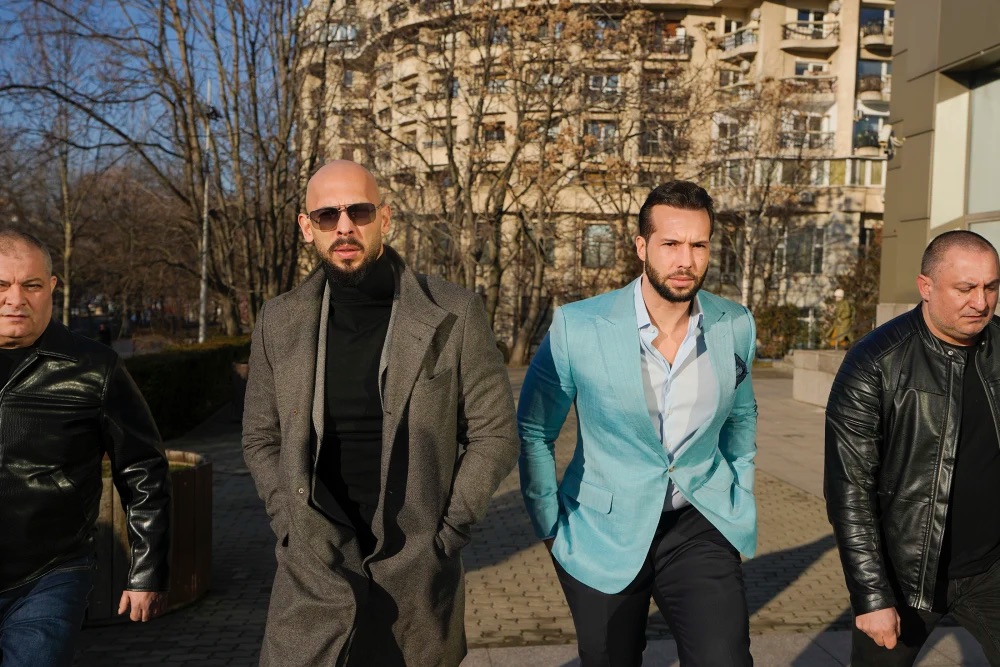 Andrew Tate, center left, and his brother, Tristan Tate, center right, outside the Bucharest Tribunal in Bucharest, Romania, in 2024.