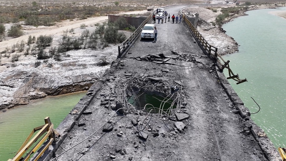 Damage is seen on the Bandar Abbas-Rudan bridge after U.S. strikes in southern Iran on July 18, 2026.