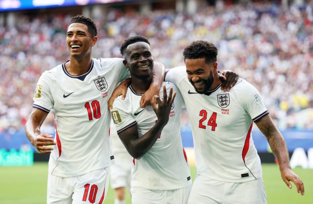 England's Bukayo Saka celebrates scoring their fifth goal to complete a hat-trick with Jude Bellingham and Reece James during Saturday's World Cup third place match.