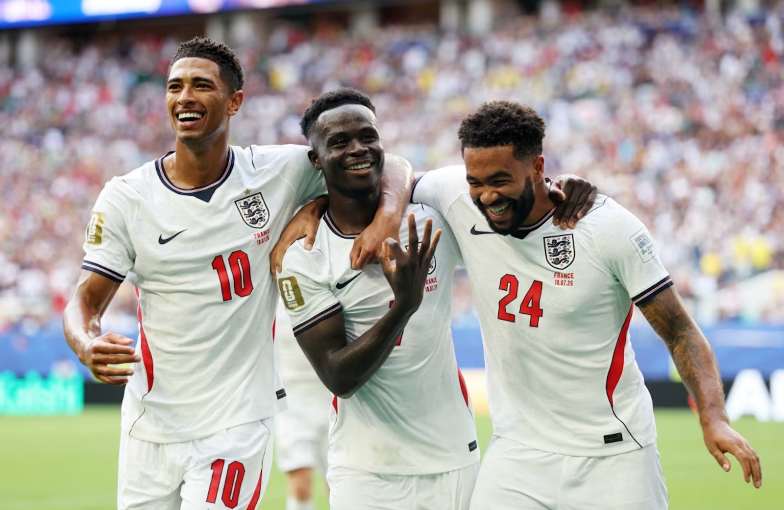 England's Bukayo Saka celebrates scoring their fifth goal to complete a hat-trick with Jude Bellingham and Reece James during Saturday's World Cup third place match.