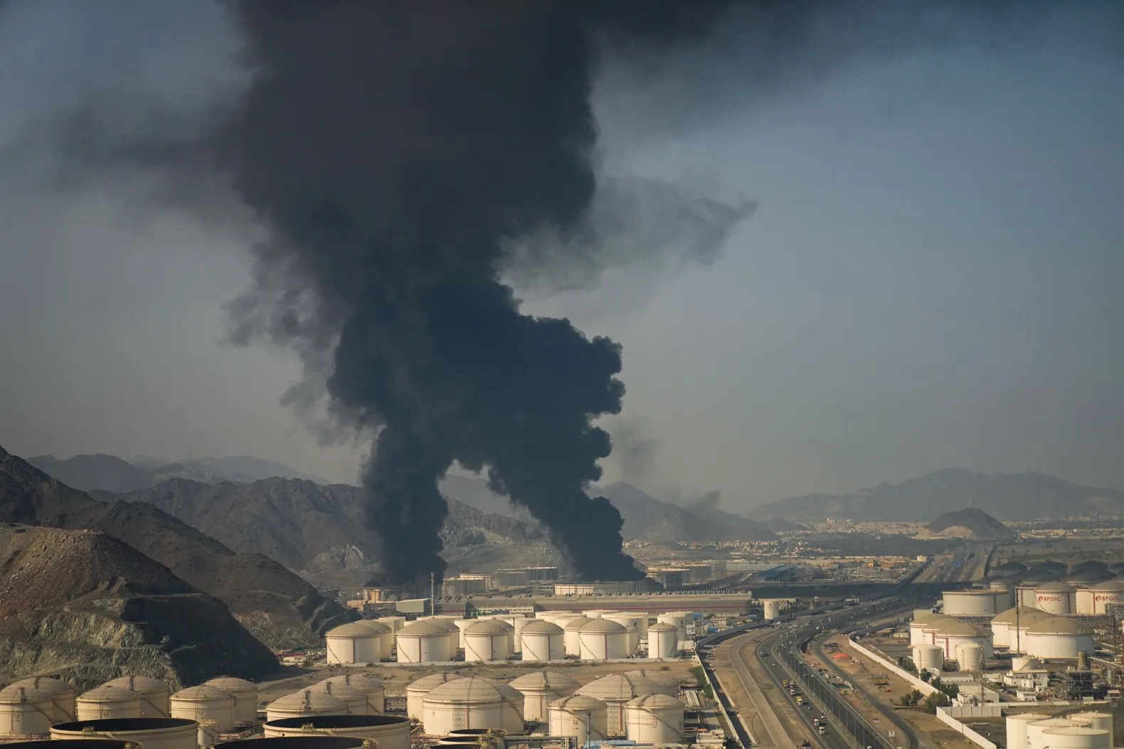Smoke rises over the Fujairah oil terminal after debris from an intercepted drone caused a fire, in Fujairah, United Arab Emirates, on March 4, 2026. 