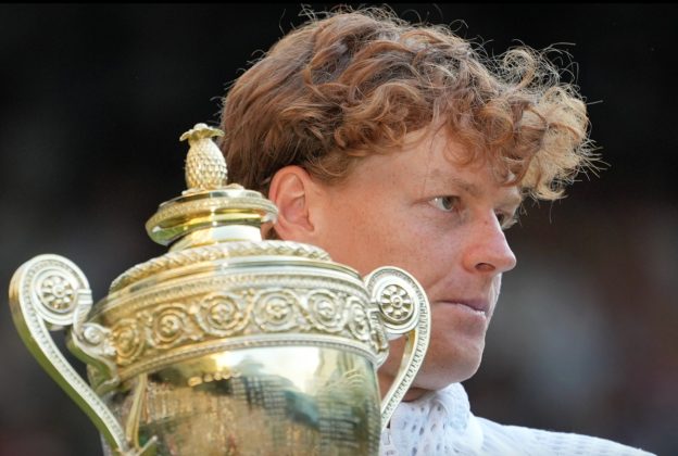 Jannik Sinner of Italy holds up the winners trophy after defeating Alexander Zverev of Germany in the men&rsquo;s singles final at Wimbledon Tennis Championships in London, Sunday,