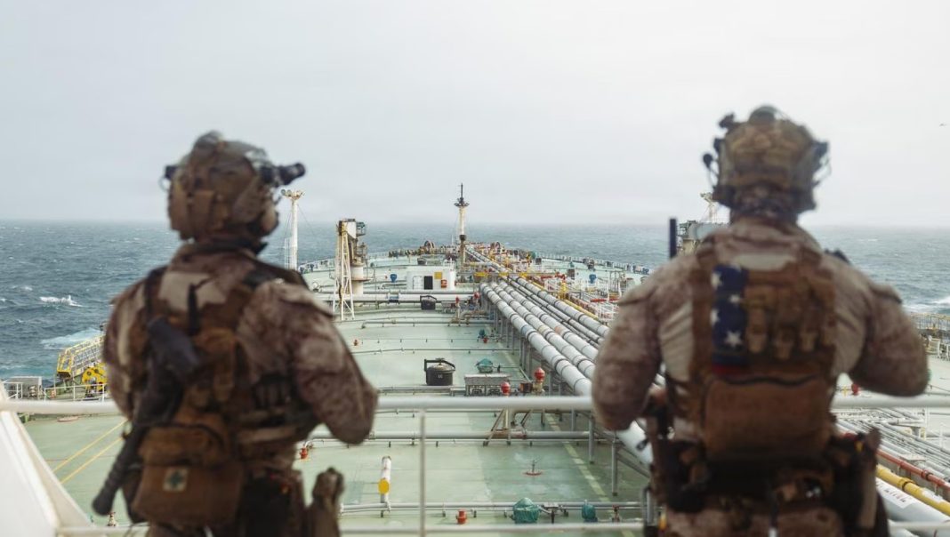 U.S. troops stand guard aboard an oil tanker during a maritime security operation near the Strait of Hormuz in an undated handout photograph.