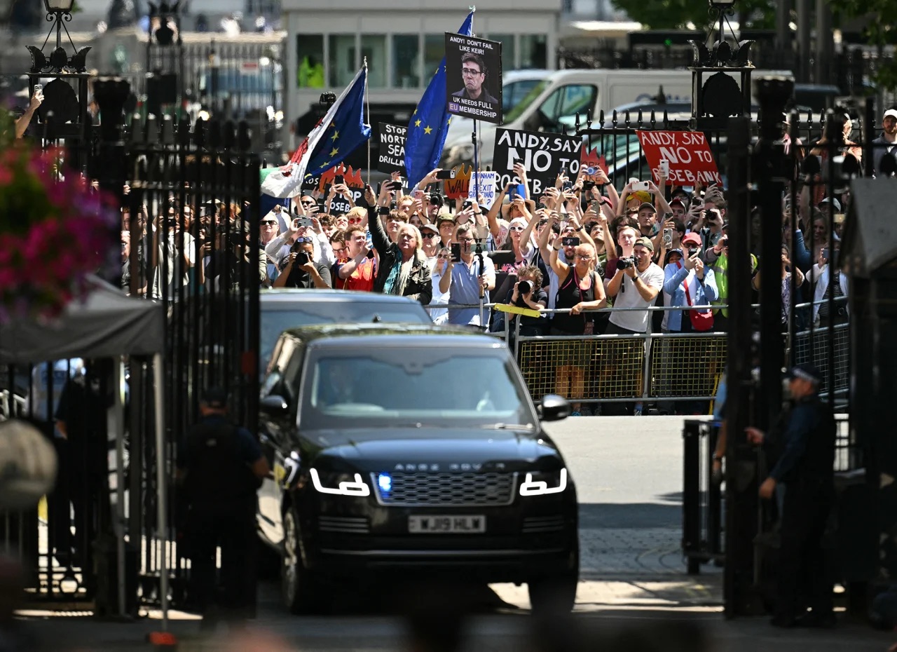 Protesters gather outside Downing Street as British Prime Minister Andy Burnham takes office in London on July 20, 2026.