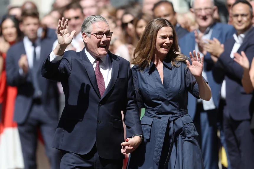 Former British Prime Minister Keir Starmer and his wife, Victoria Starmer, depart Downing Street after he stood down as prime minister in London