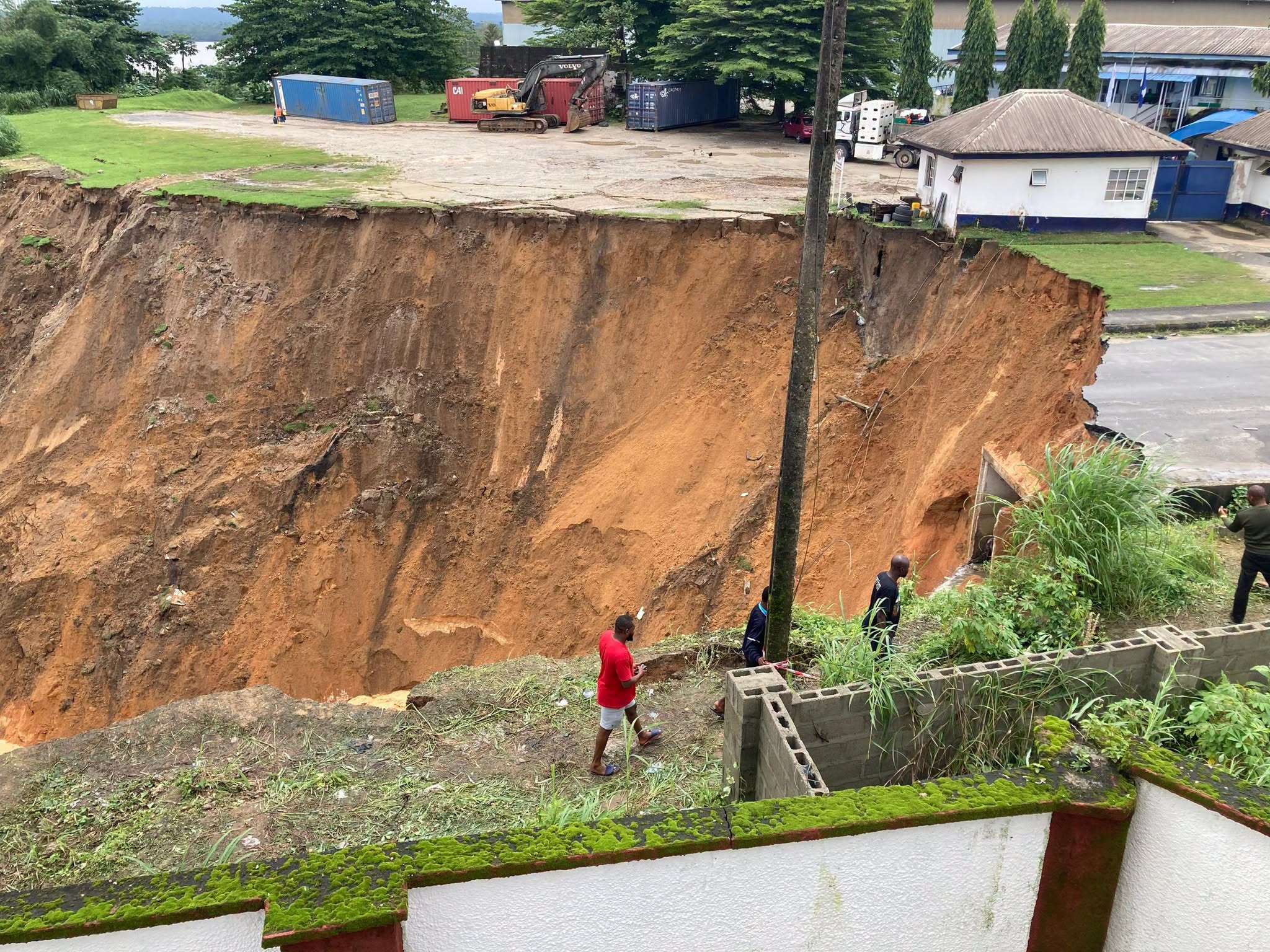 A section of Anansa Road in Calabar, Cross River State, is seen after a landslide triggered by persistent rainfall damaged the