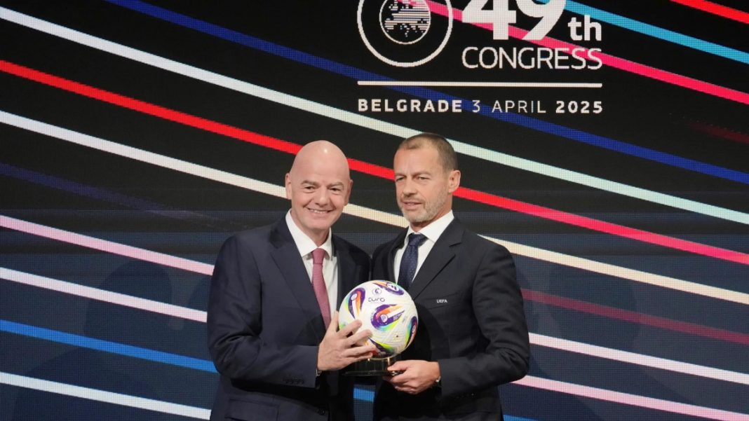 UEFA President Aleksander Ceferin and FIFA president Gianni Infantino, left, holding a ball during the 49th UEFA