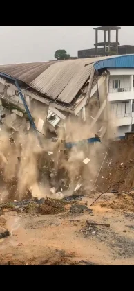A section of UNICEM Clinic collapses after a landslide triggered by persistent rainfall worsened along Anansa Road in Calabar, Cross River State, in August 2026. | Screengrab from Video