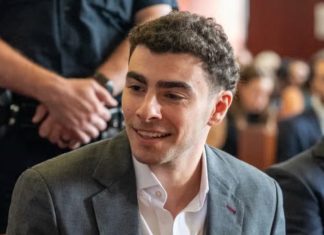 Luigi Mangione Returns to Court as Judge Orders Anonymous Jury for September Murder Trial Luigi Mangione speaks with his lawyers during a pretrial hearing in his murder case in