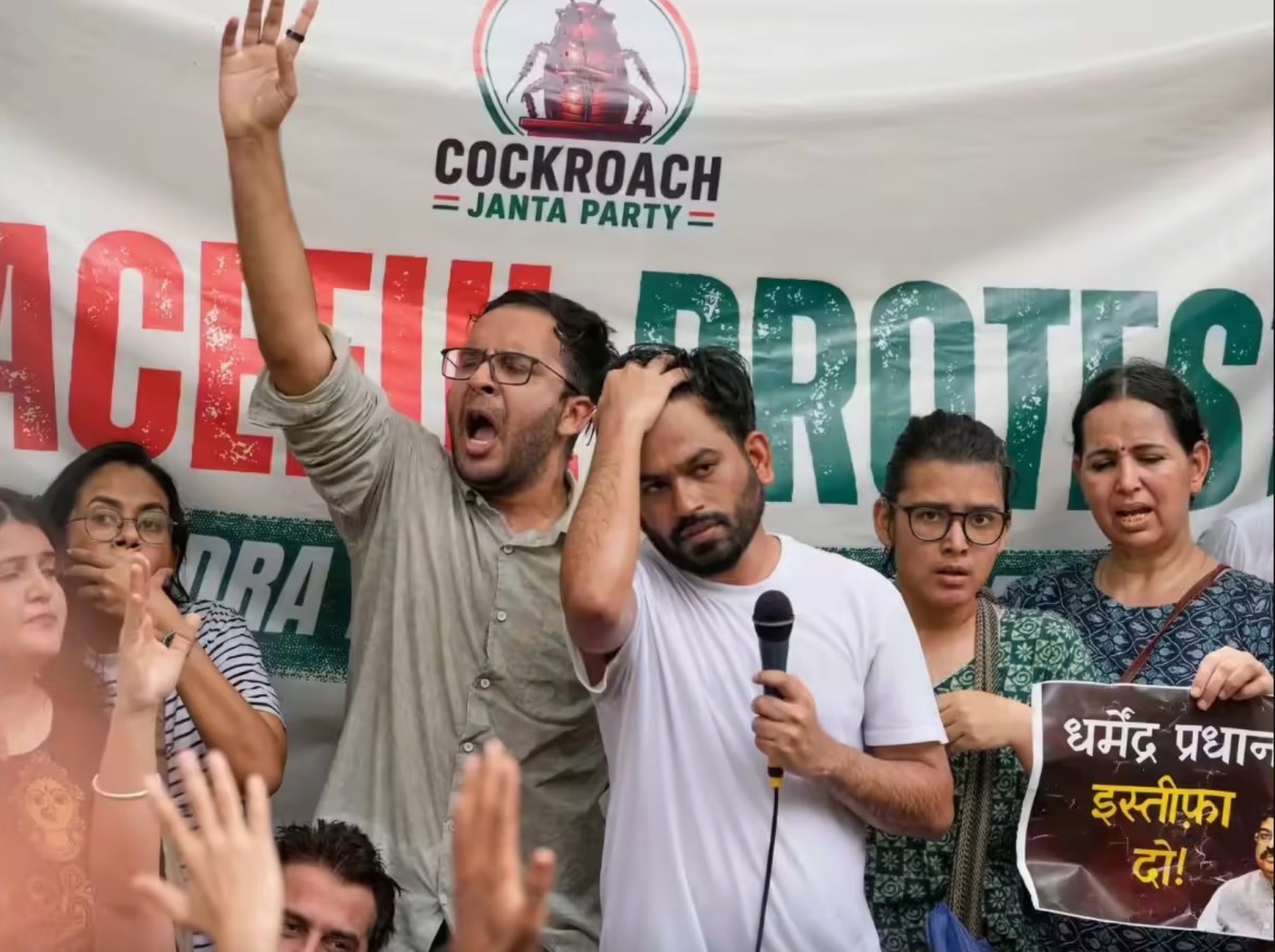 Cockroach Janta Party founder Abhijeet Dipke, centre, speaks during a protest demanding the resignation of Union Education Minister Dharmendra Pradhan over alleged examination lapses at Shaheed Smarak in Jaipur, Rajasthan, in June 2026. | PTI