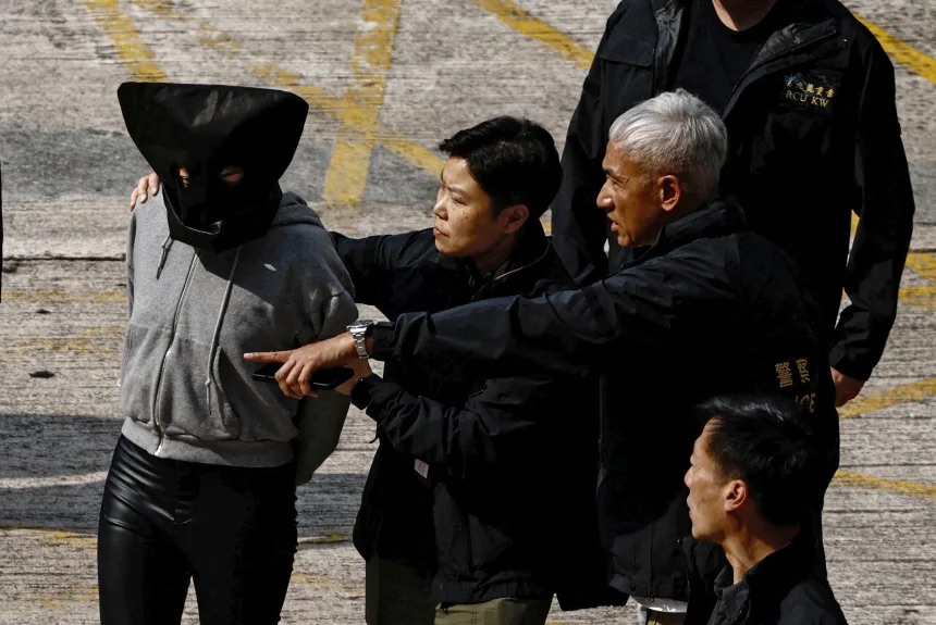 A suspect involved in the murder of model Abby Choi is seen at a police station after being transferred from mainland China in Hong Kong, on March 7, 2023.