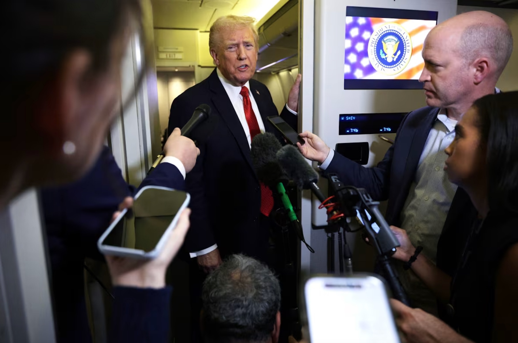 President Donald Trump speaks to members of the press on October 19, 2025 aboard Air Force One. |