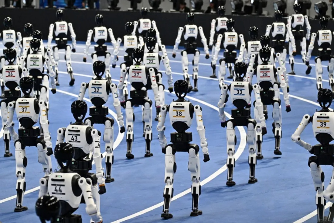 Humanoid robots take part in the opening ceremony of the 2nd World Humanoid Robot Games in Beijing