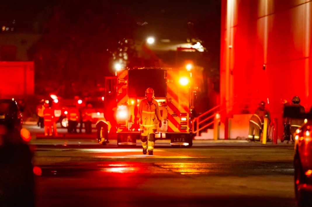 First responders work the scene after a helicopter crashed near a bus crash in Chatsworth, California, on September 15.