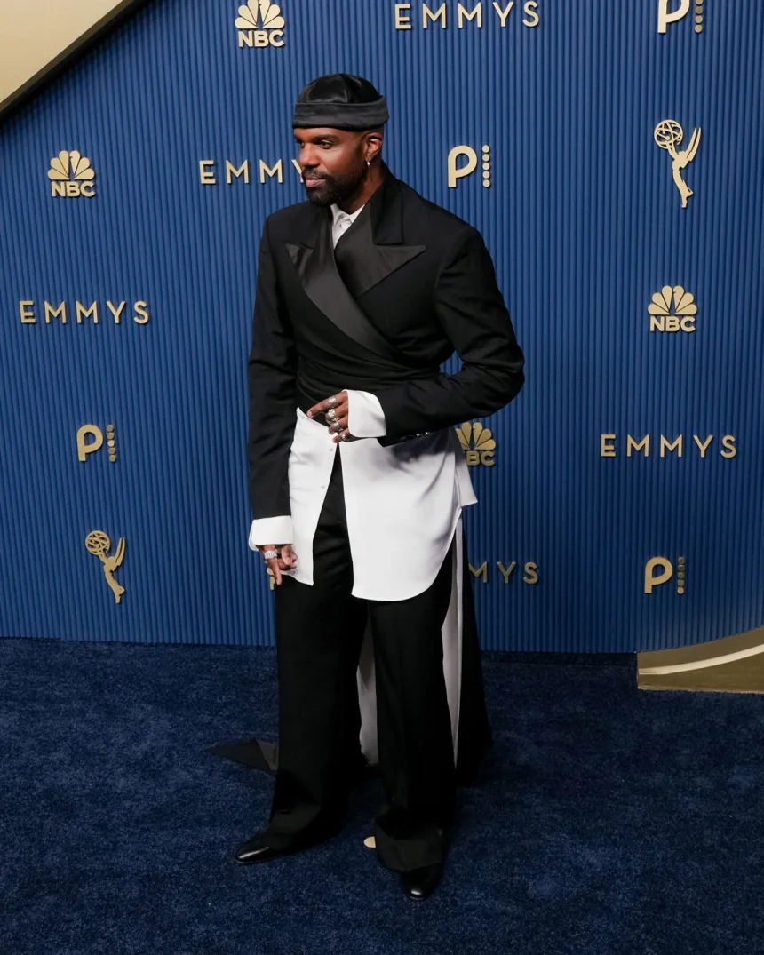 Carl Clemons-Hopkins, star of Hacks, attends the 78th Primetime Emmy Awards in Los Angeles in a deconstructed black-and-white tuxedo, September 14, 2026.