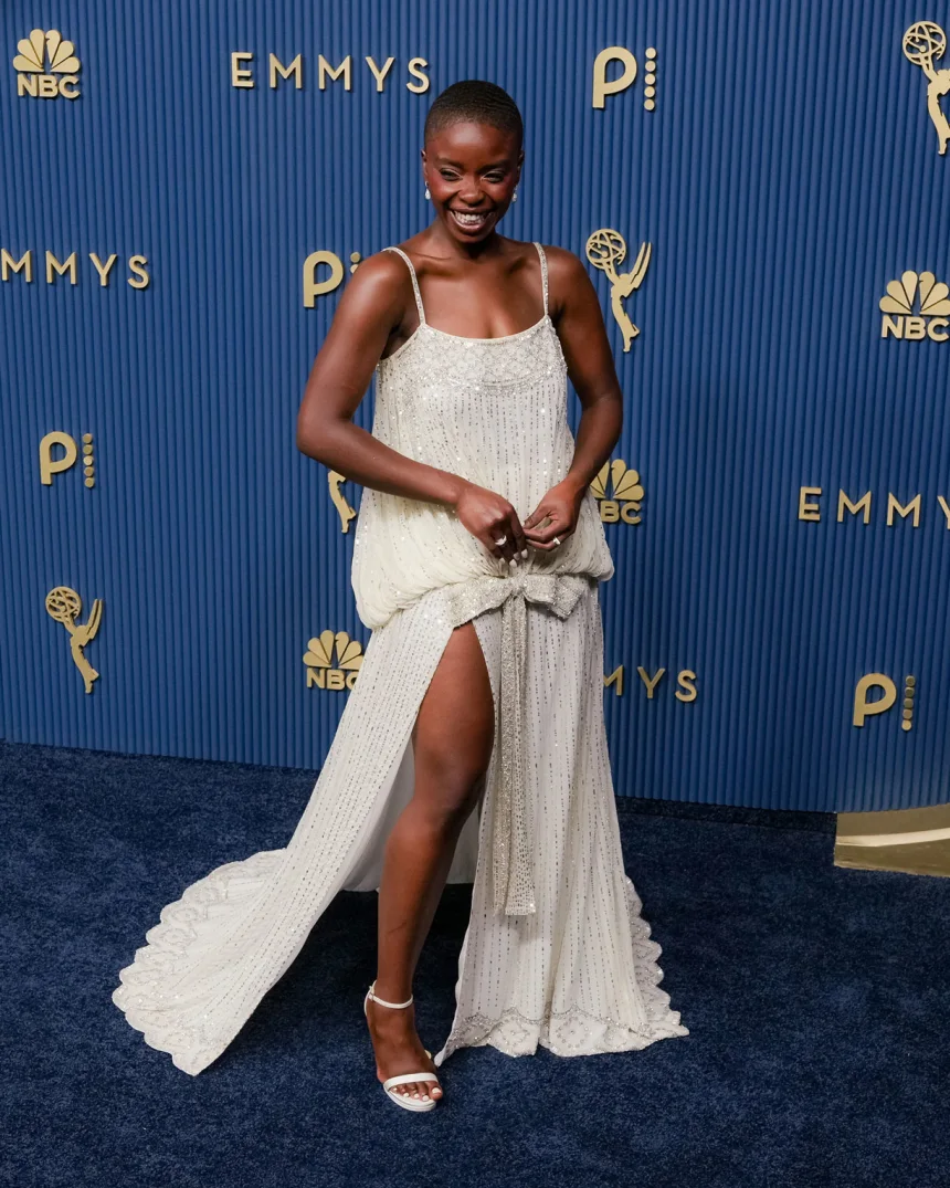 Joy Sunday attends the 78th Primetime Emmy Awards at the Peacock Theater in Los Angeles on September 14, 2026, wearing an embroidered white Dior gown with a thigh-high slit. 