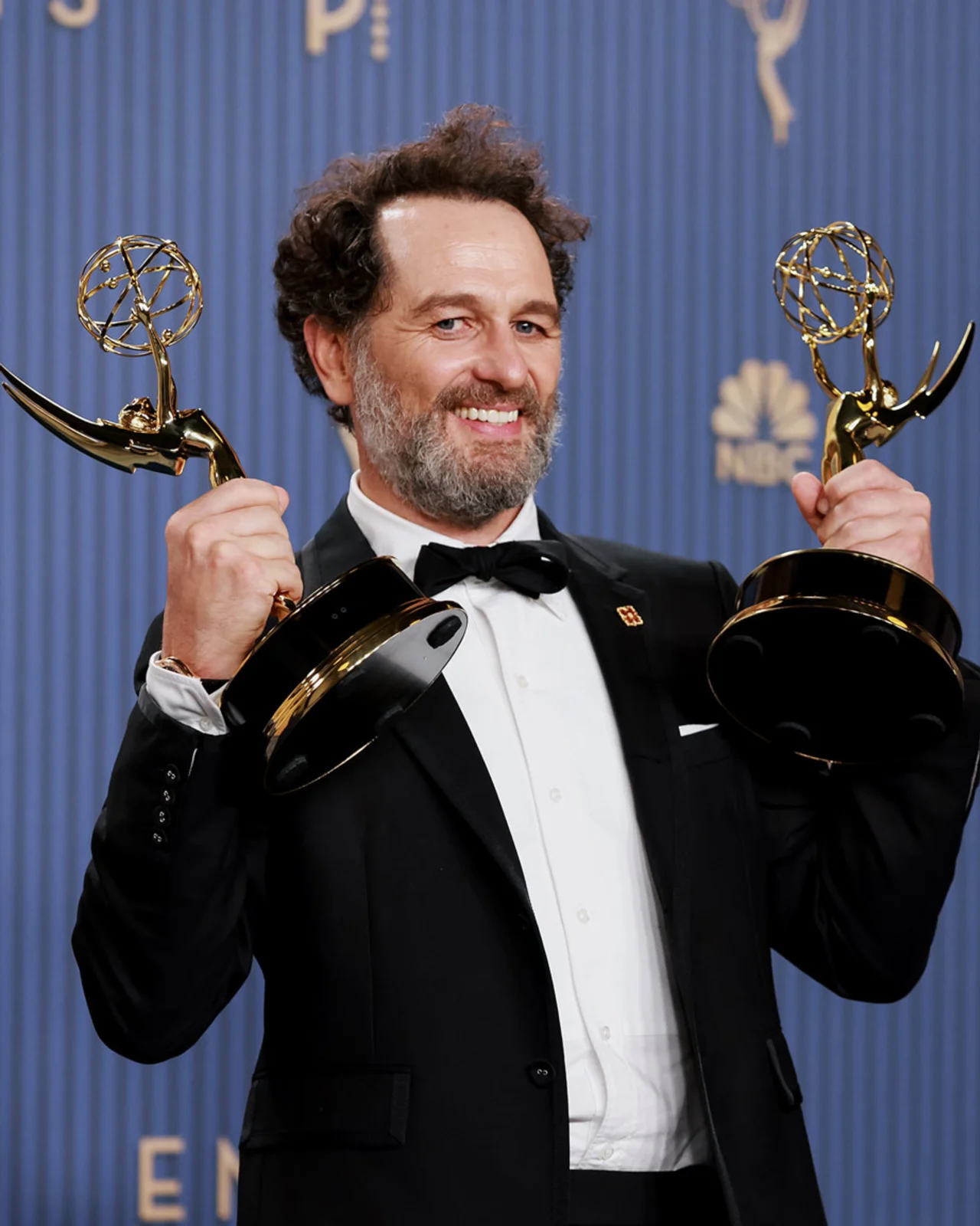 Matthew Rhys holds his statuette after at the Emmy Awards in Los Angeles, on September 14, 2026.