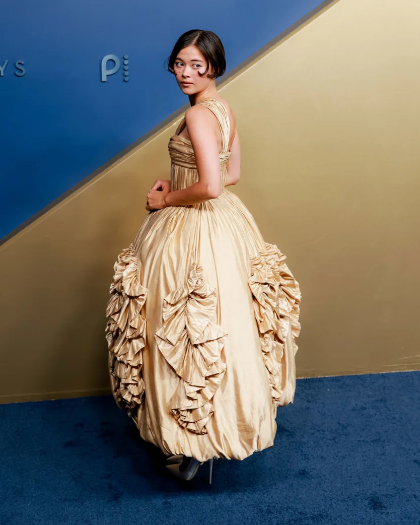 LOS ANGELES, CALIFORNIA – SEPTEMBER 14: “Shrinking” star Lukita Maxwell attends the 78th Primetime Emmy Awards at the Peacock Theater on Monday, September 14, 2026, wearing a champagne-gold Louis Vuitton gown featuring a gathered bodice and voluminous ruffled skirt. | Jennelle Fong for CNN