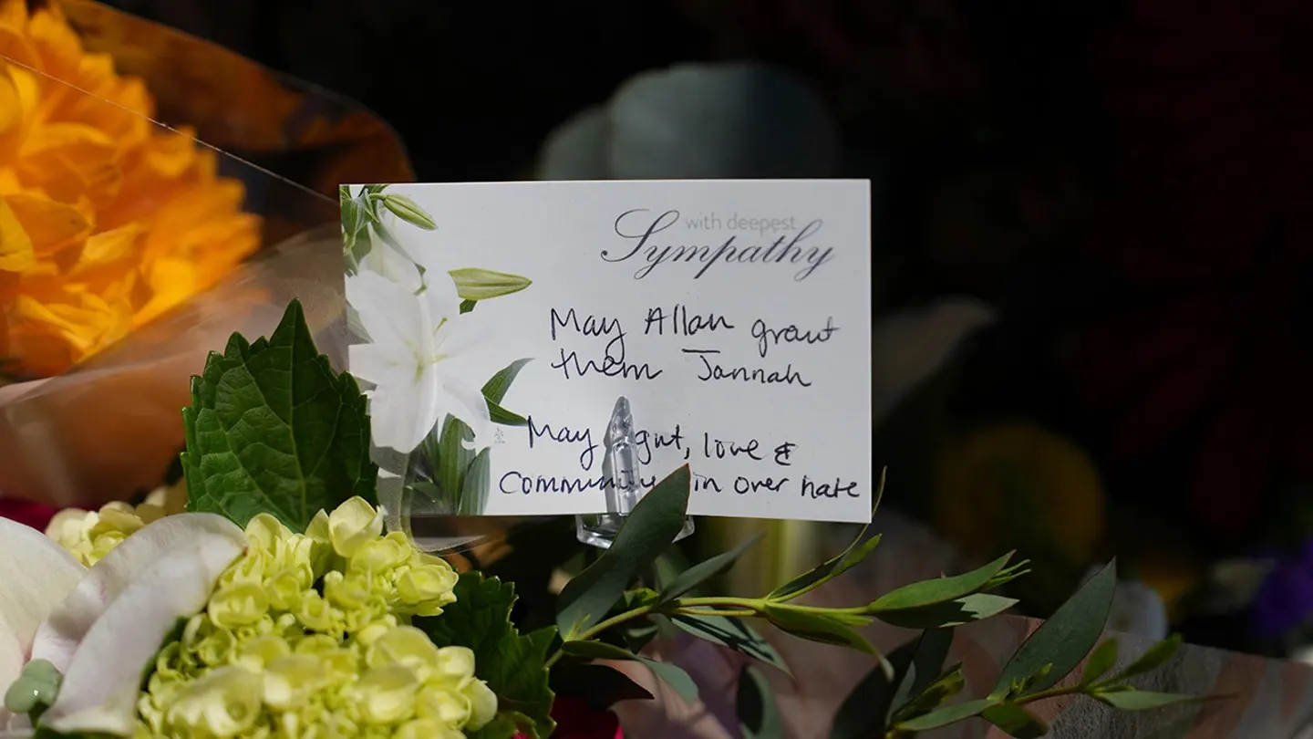 A note attached to flowers is placed outside the Islamic Center of San Diego on May 19, 2026.