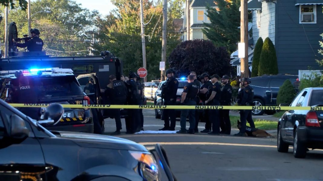 In this image from video provided by WJET, police gather outside the scene of a shooting in Erie, Pa., on Friday evening, Oct. 9, 2026. | Matt Barnum/WJET via AP