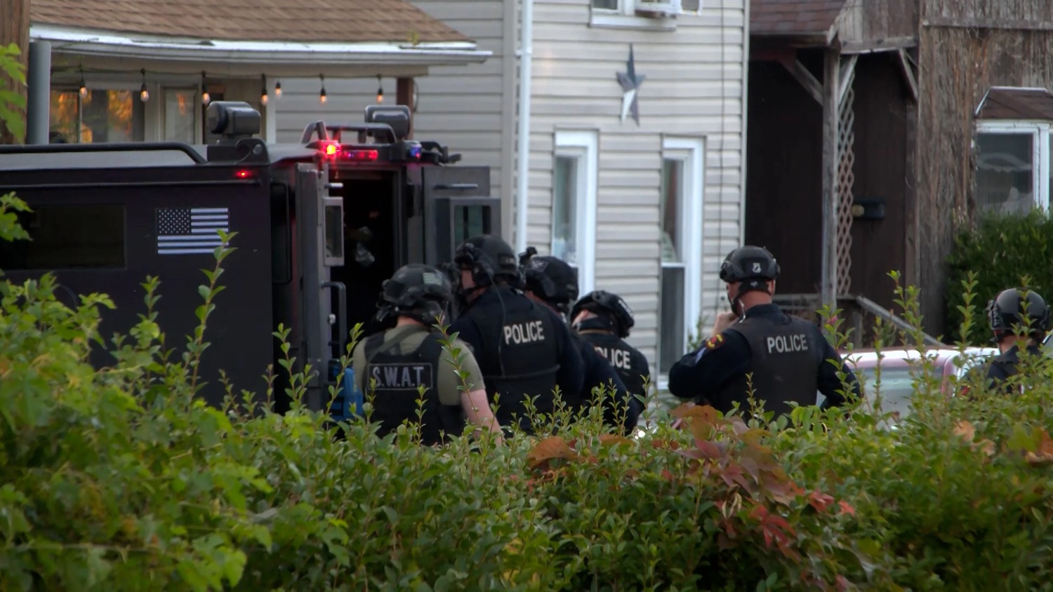 In this image from video provided by WJET, police gather outside the scene of a shooting in Erie, Pa., on Friday evening, Oct. 9, 2026.
