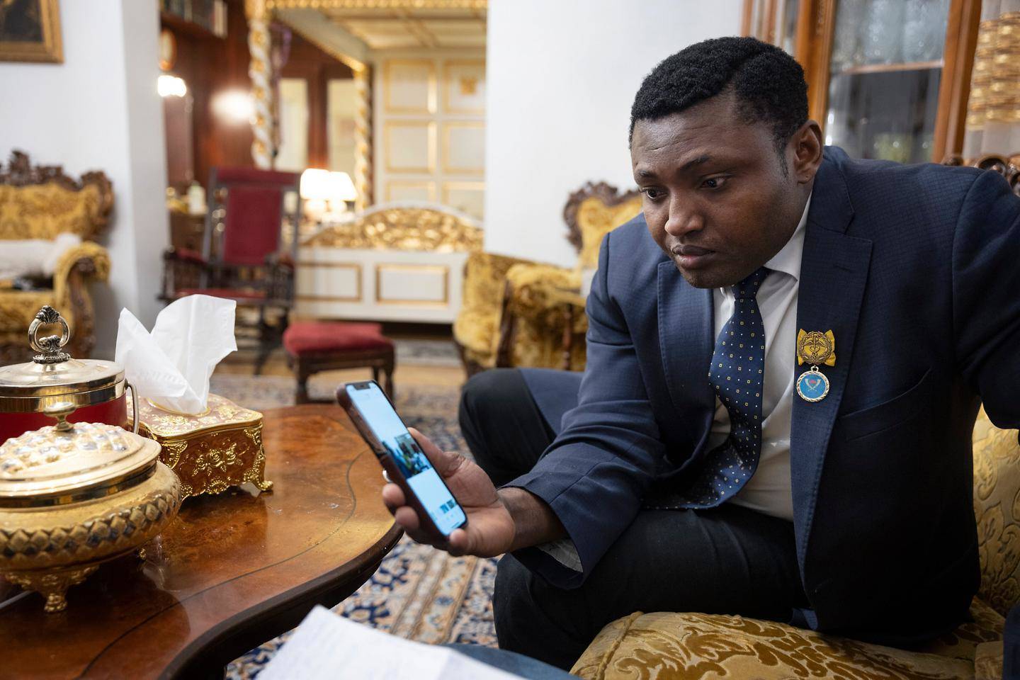 Simon Ekpa with a mobile phone in his hand an undated photo.