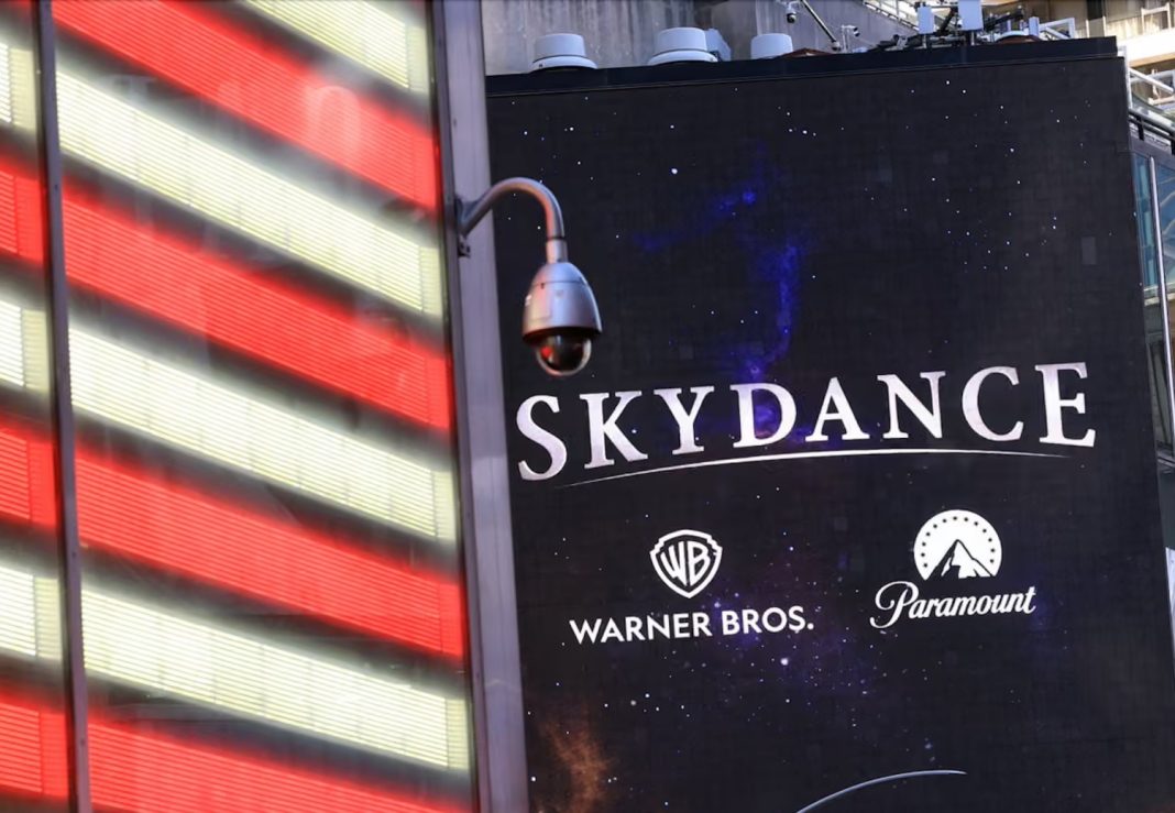 A billboard displaying the logos of Skydance, Warner Bros and Paramount on the Paramount Global offices in New York.