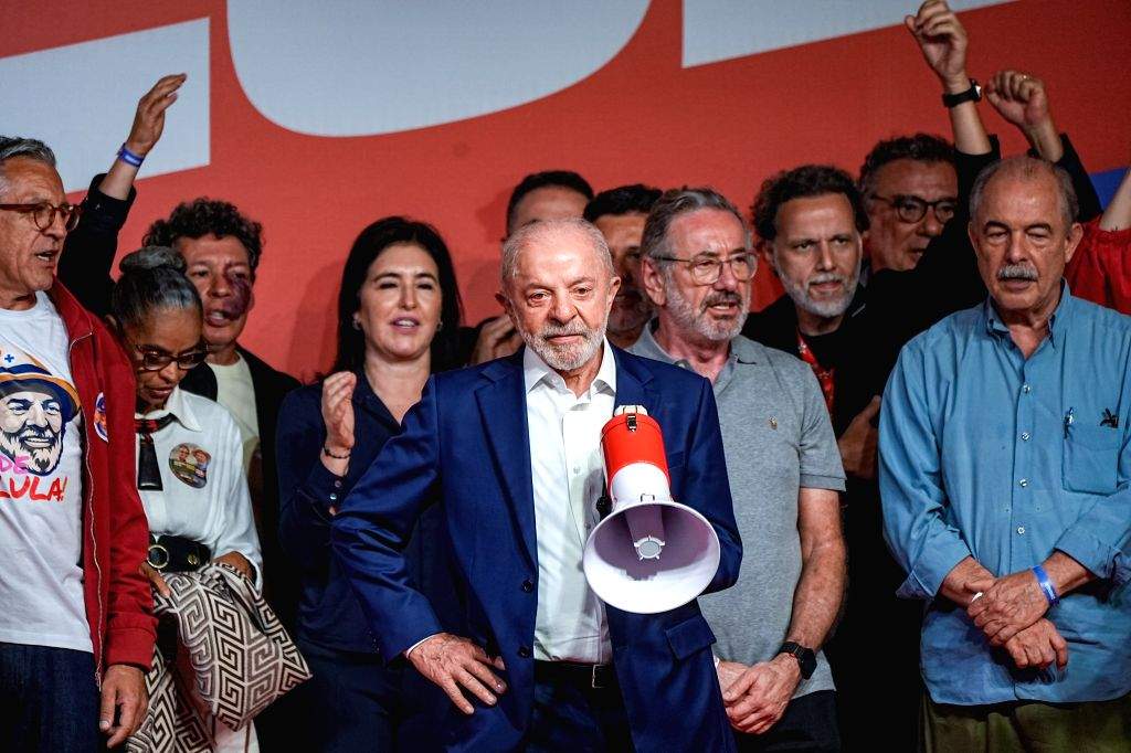 Brazilian President Luiz Inácio Lula da Silva stands with supporters following the announcement of the first round presidential election results in São Paulo, Brazil, on Sunday, October 4, 2026.