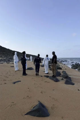 This image provided by the International Organization for Migration shows authorities intervening after a migrant ship