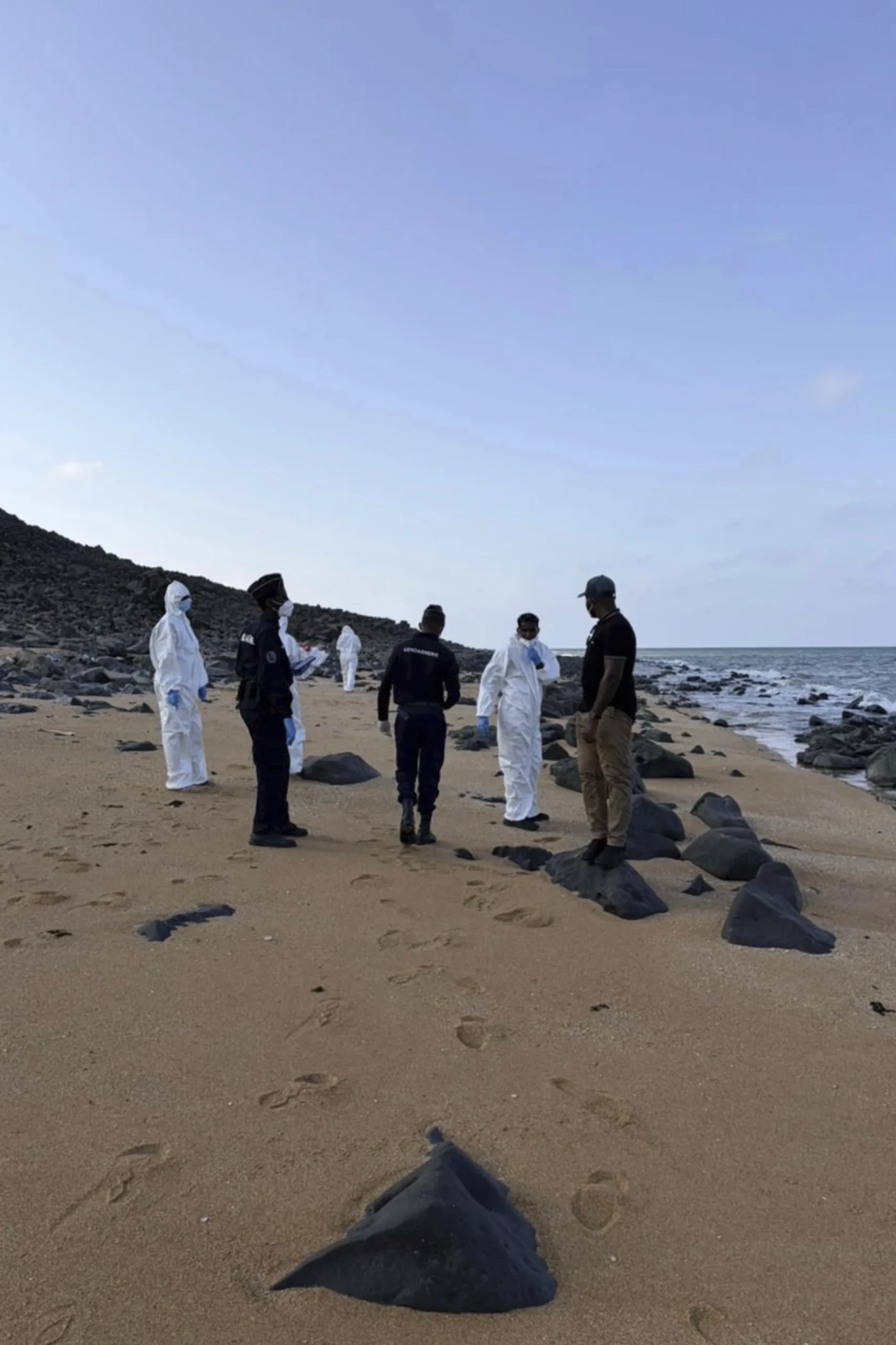 This image provided by the International Organization for Migration shows authorities intervening after a migrant ship