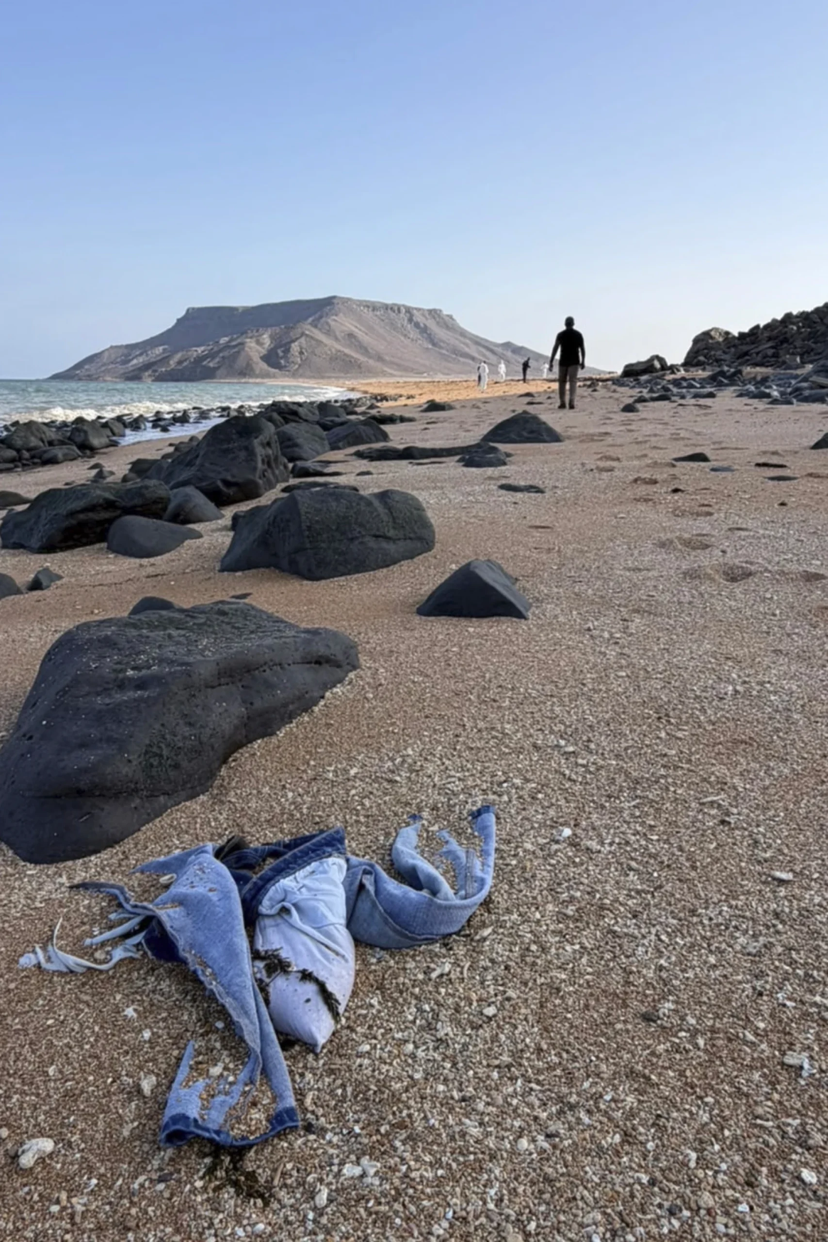 This image provided by the International Organization for Migration shows authorities intervening after a migrant ship capsized near Guhere, north of Obock, in Djibouti, Saturday, Oct. 11, 2026.