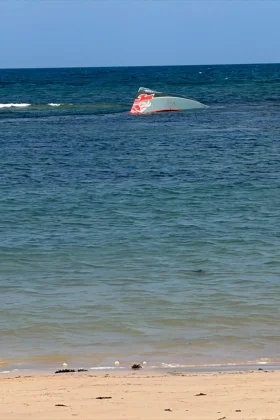 This image provided by the International Organization for Migration shows a boat after it capsized near Guhere, north of Obock, in Djibouti, Saturday, Oct. 11,